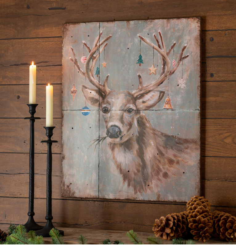 The Canton Christmas Shop Christmas Deer Iron Plaque from Park Hill Collection on mantle